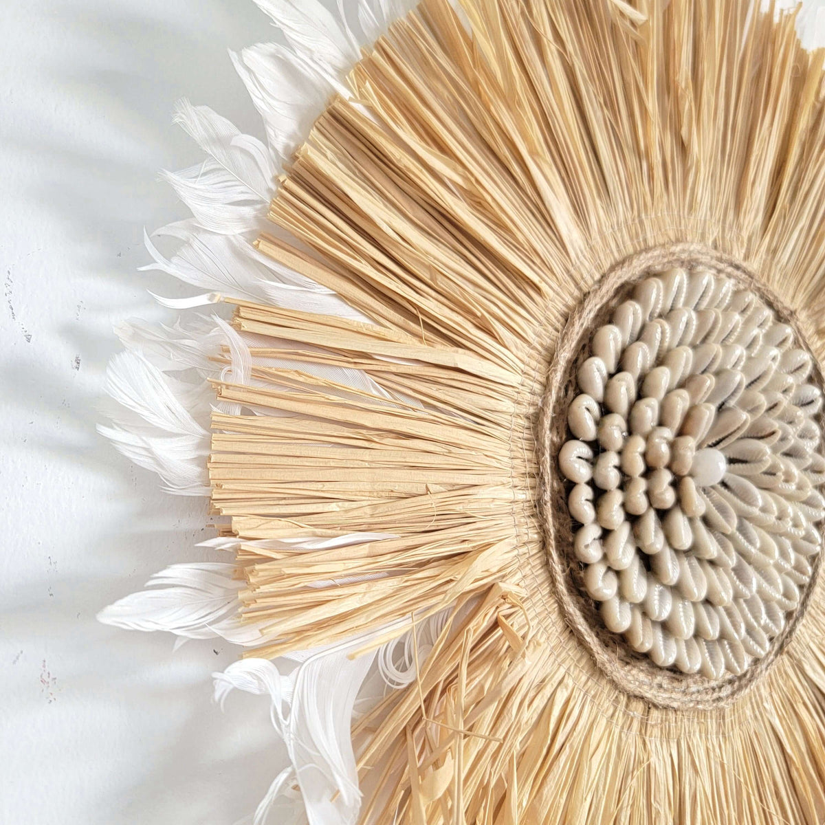Seashell & Raffia & feathers juju hat Wall Decor - Boho, featuring natural textures of straw, feathers, and seashells.