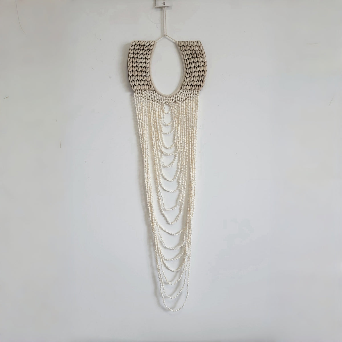 Handmade Layered Shell & Bead Wall Hanging | Boho Coastal Wall Decor Boho Coastal Handmade Shell Wall Art with Layered Bead Strands  Artisan-Crafted Shell & Pearl-Like Bead Wall Hanging | Nautical Boho Decor