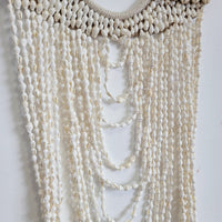 Handmade Layered Shell & Bead Wall Hanging | Boho Coastal Wall Decor Boho Coastal Handmade Shell Wall Art with Layered Bead Strands  Artisan-Crafted Shell & Pearl-Like Bead Wall Hanging | Nautical Boho Decor