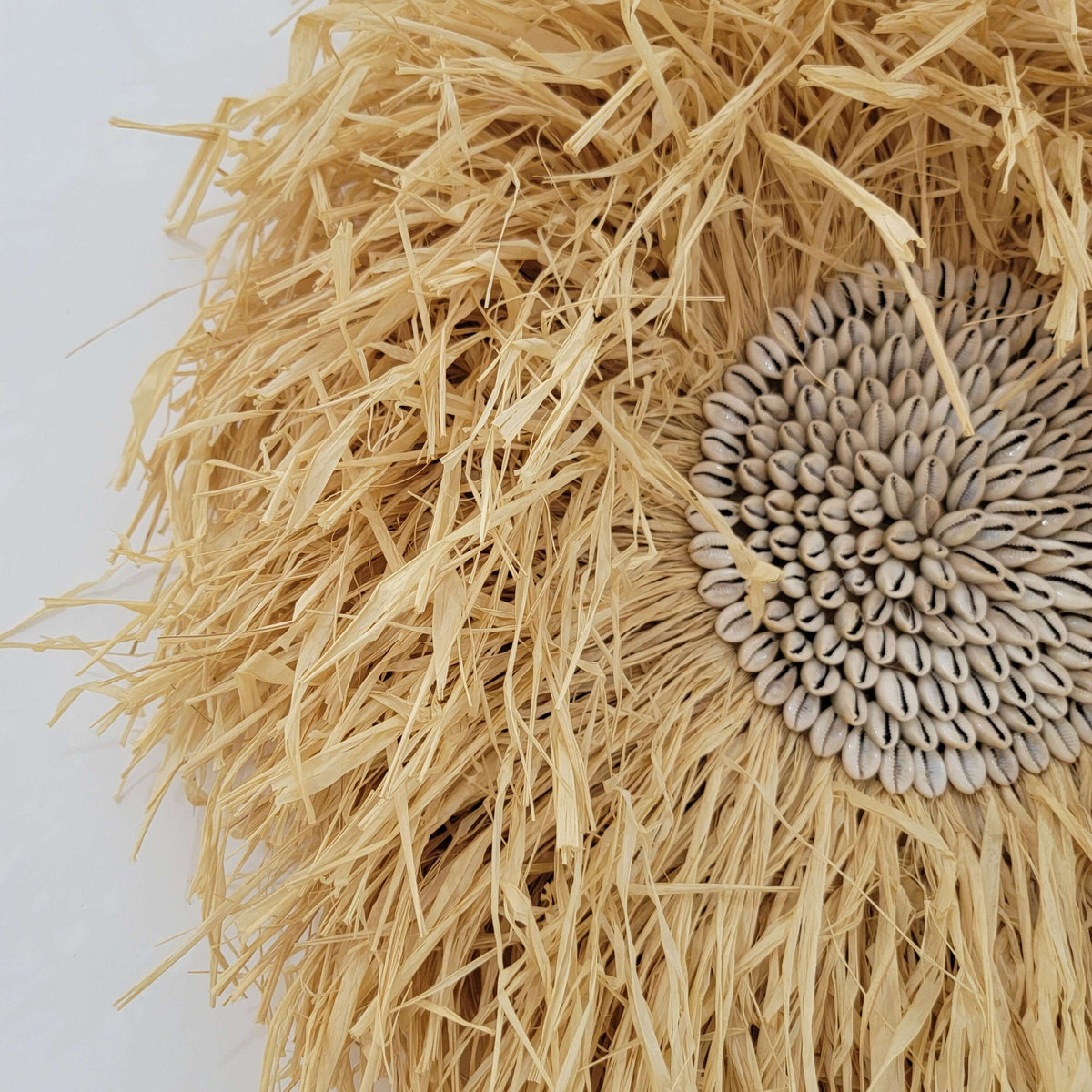 Seashell & Raffia juju hat Wall Decor - Boho, featuring natural straw and sunflower seed design.