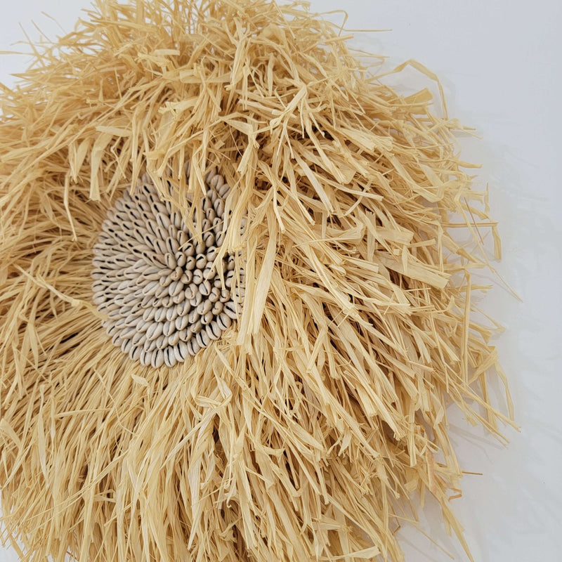 Seashell & Raffia juju hat Wall Decor - Boho showcasing rustic straw fibers and a sunflower seed cluster.