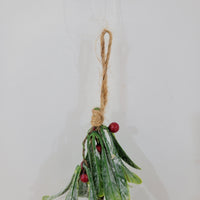 Artificial Christmas mistletoe hanging decoration with red berries and hemp rope.