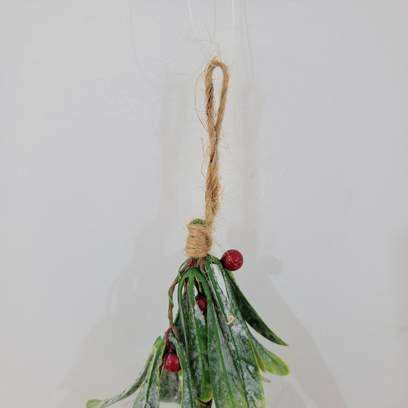 Artificial Christmas mistletoe hanging decoration with red berries and hemp rope.