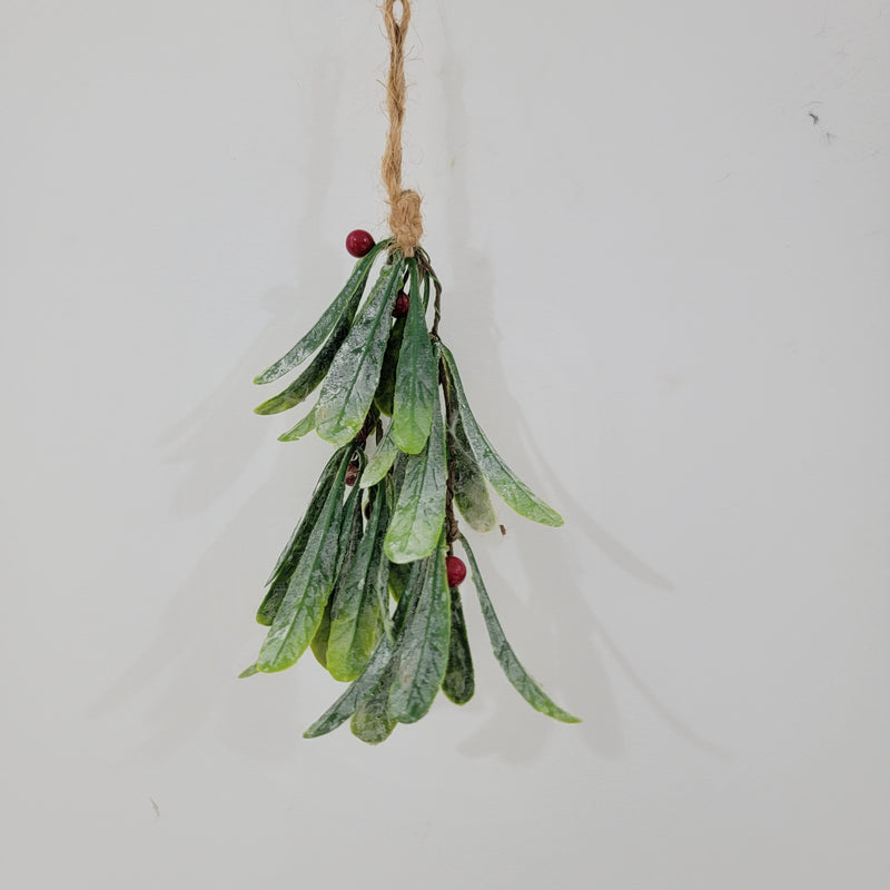 Artificial Christmas mistletoe hanging decoration with red berries and hemp rope.