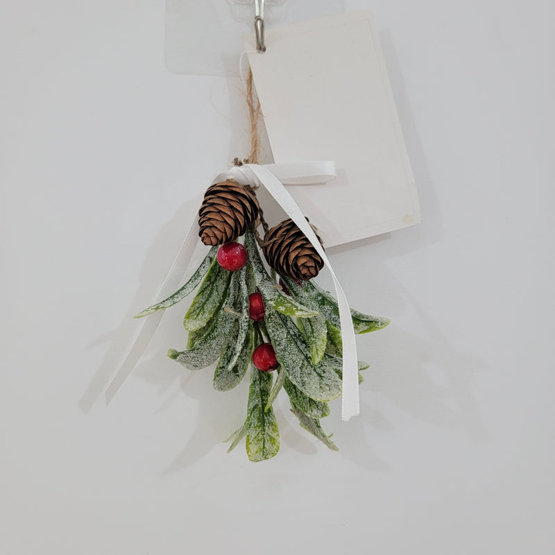 Artificial mistletoe decoration with green leaves and white, gold berries, tied with a ribbon, perfect for holiday decor.
