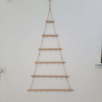 Rustic wooden christmas tree wall mounted hook rack showcasing handcrafted tree design with hanging hooks.