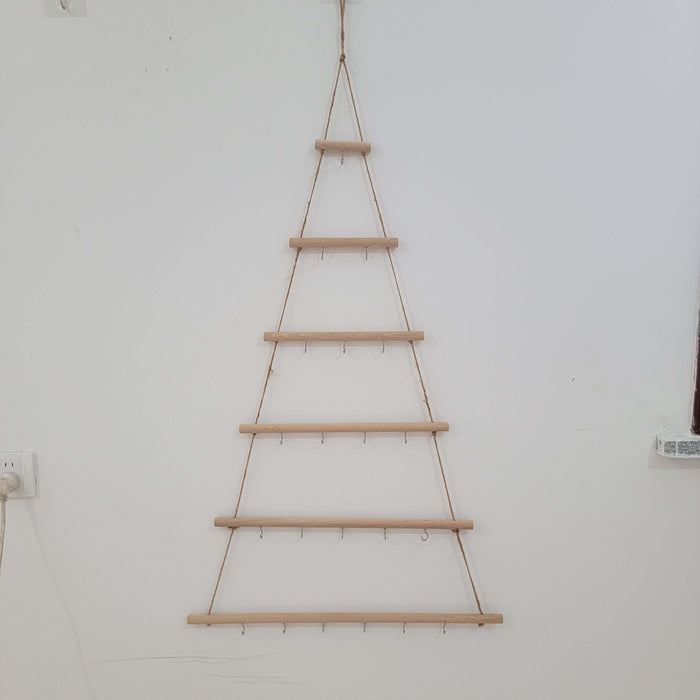 Rustic wooden christmas tree wall mounted hook rack showcasing handcrafted tree design with hanging hooks.