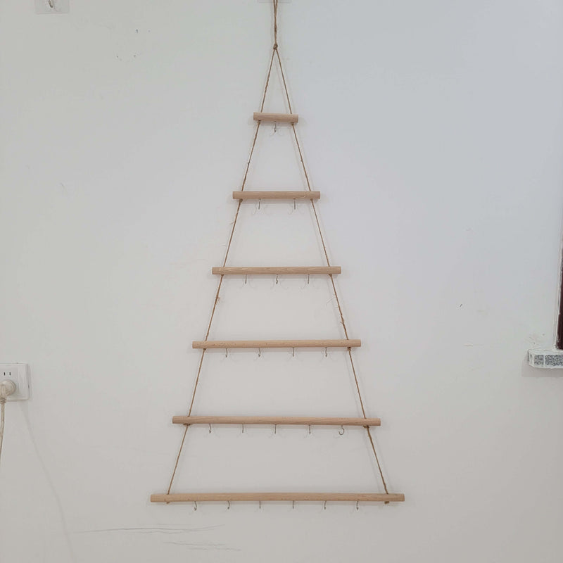 Rustic wooden christmas tree wall mounted hook rack showcasing handcrafted tree design with hanging hooks.