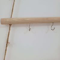 Rustic wooden christmas tree wall mounted hook rack featuring metal hooks and jute rope for a charming decor accent.