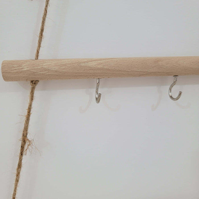 Rustic wooden christmas tree wall mounted hook rack featuring metal hooks and jute rope for a charming decor accent.