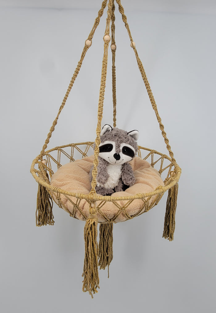 macrame cat hammock featuring a plush raccoon on a cozy cushion for cat lovers and pet decor.